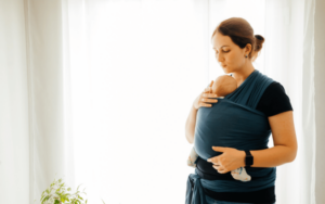 Mom wearing her baby in a snug baby wrap carrier