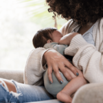 mom breatfeeding her baby in cradle hold