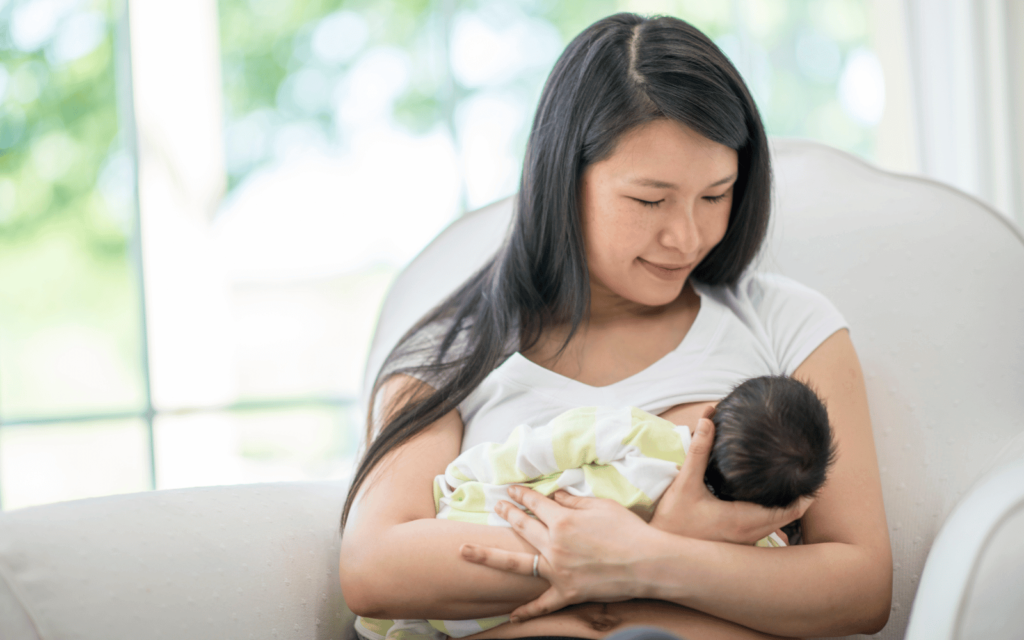 mom breastfeeding in The cross-cradle hold