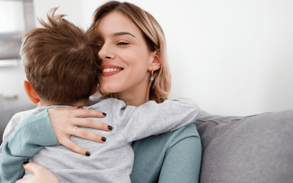 happy mom giving a hug to her son