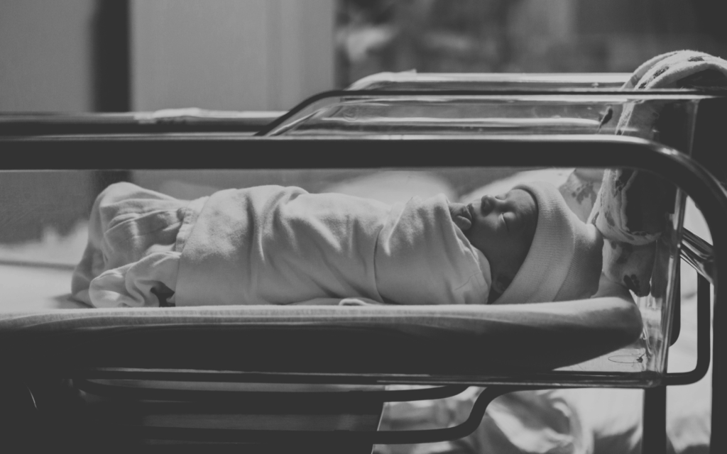 newborn baby after birth in the hospital's crib