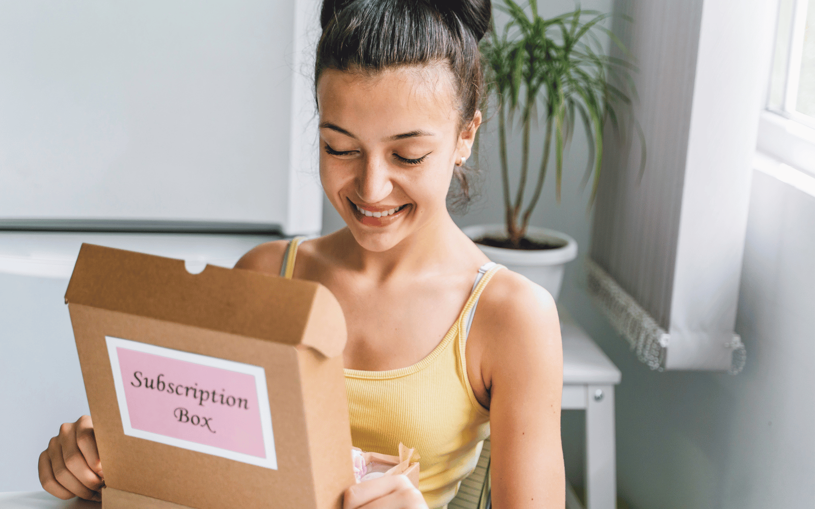 mom opening a baby welcome box