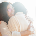 Mother and daughter hugging