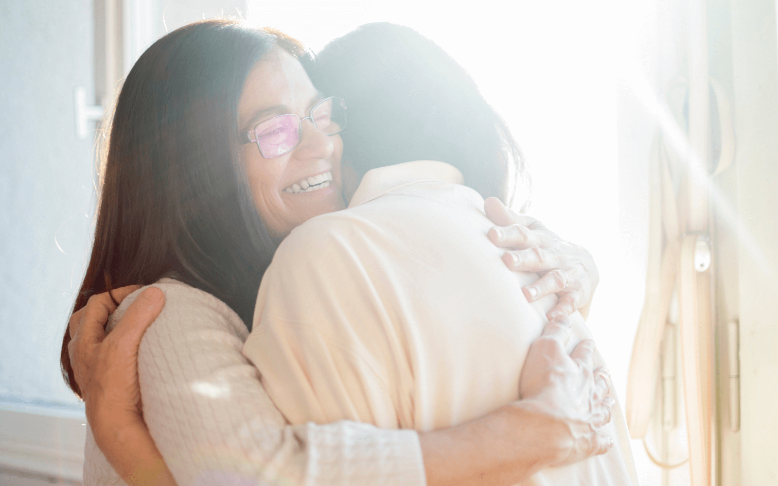 Mother and daughter hugging