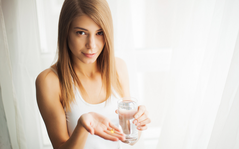 Breastfeeding mom taking a medication 