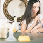 Mom feeding her baby with a thawed breast milk