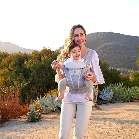 Mom wearing her baby with the Ergobaby Omni Breeze