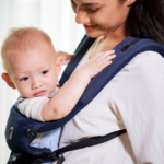 mom wearing her baby with a soft structured carrier