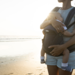 Mom wearing her baby in a carrier