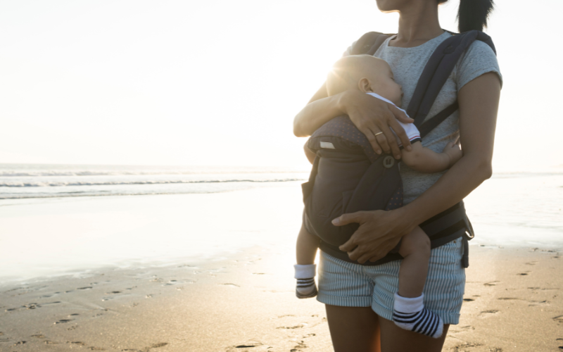 Mom wearing her baby in a carrier