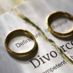 Two rings on a divorce papers