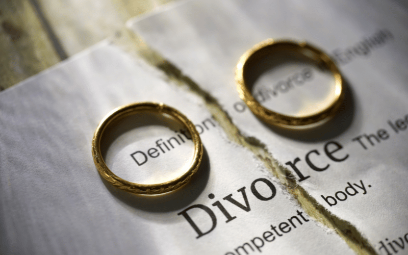 Two rings on a divorce papers