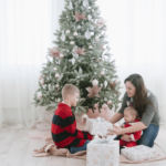 Mom and kids next to the christmas tree