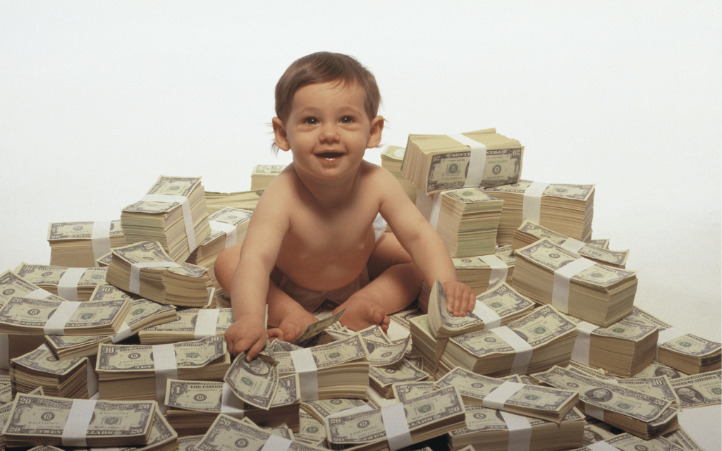 Baby sitting on a pile of money